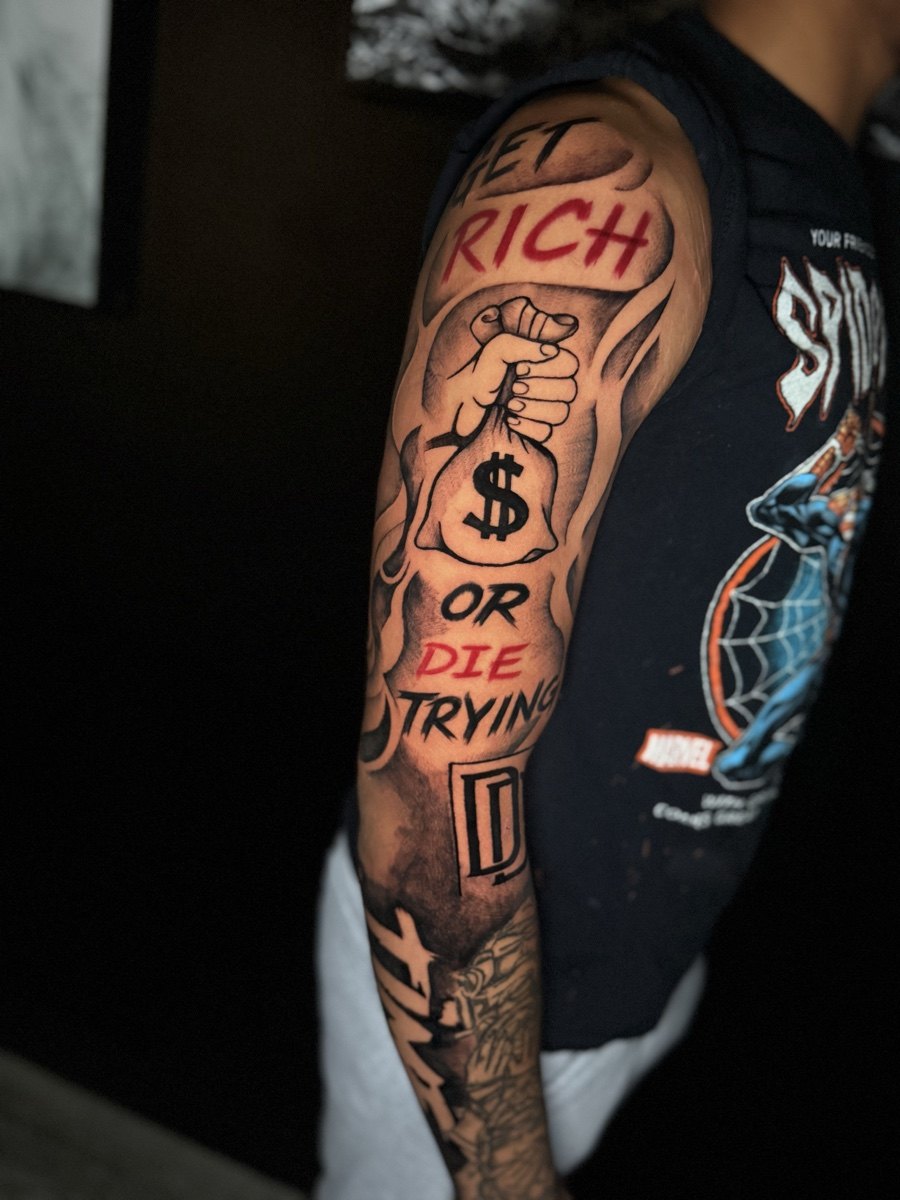Color lettering tattoo sleeve with bold graphic details.